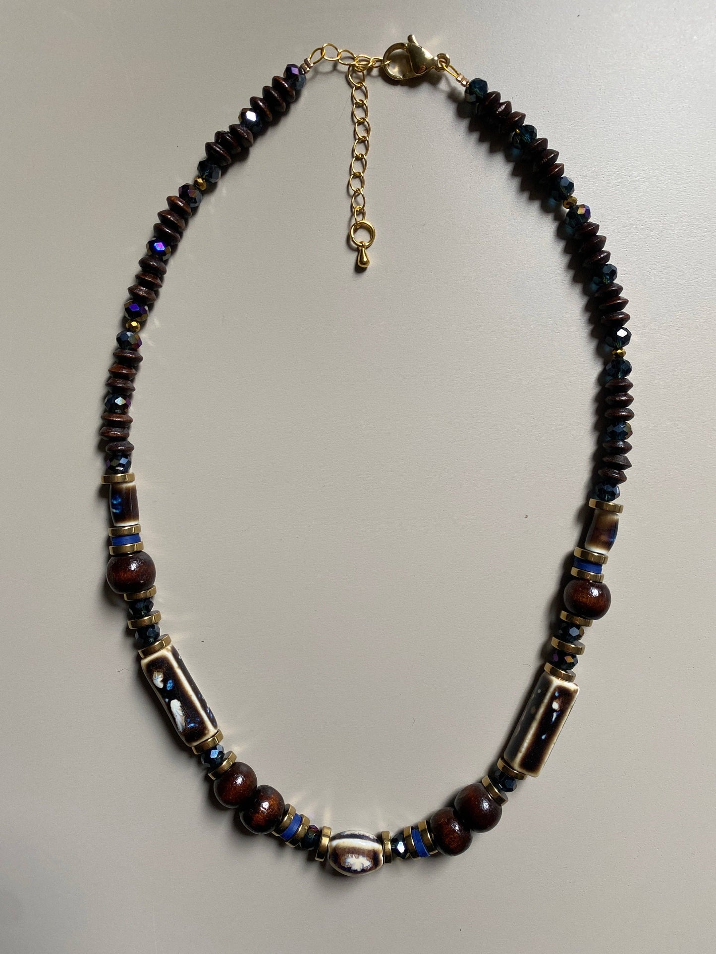 Gist Porcelain, coconut, dyed wood, clay and crystal necklace