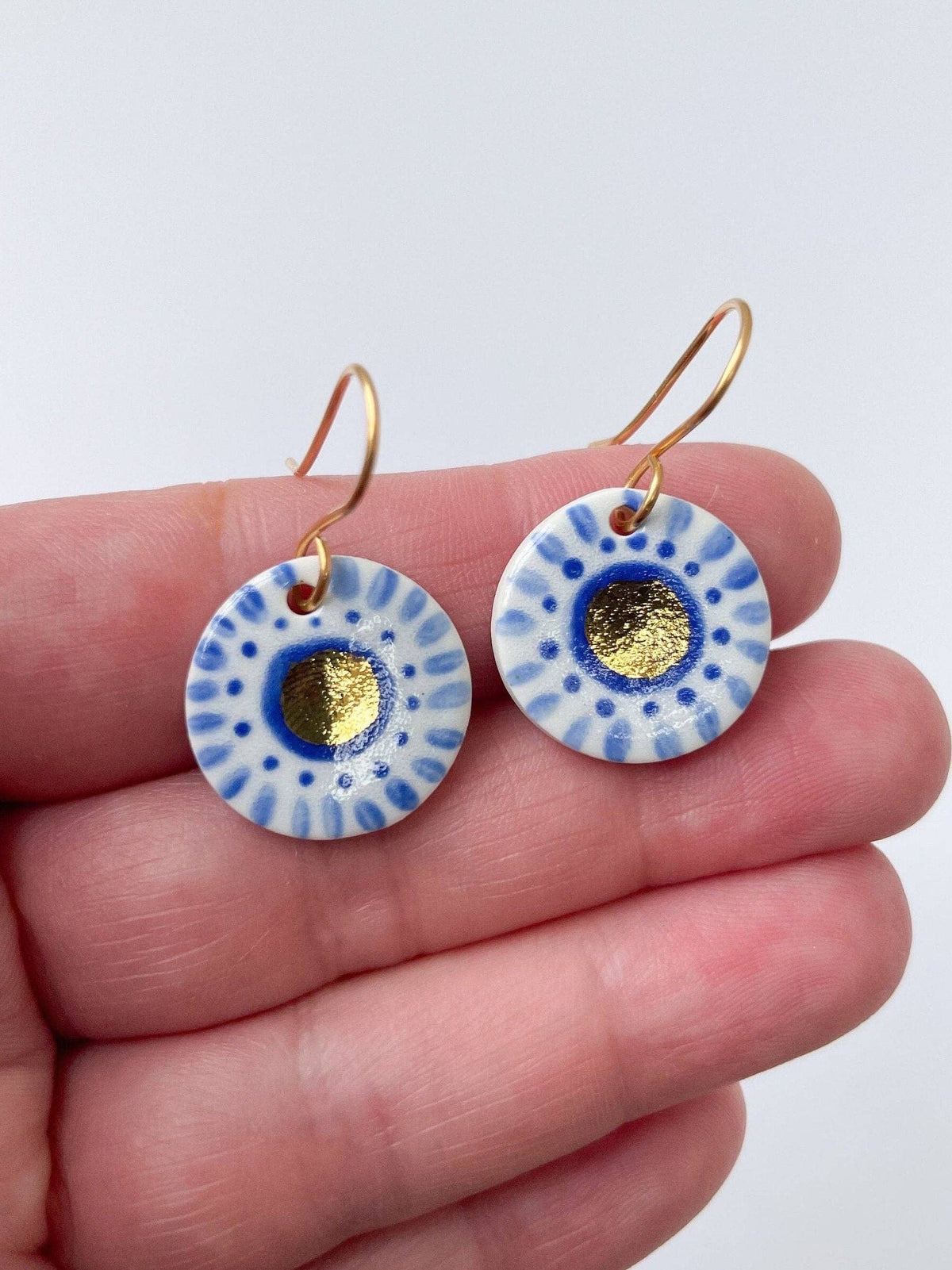 Hand Painted Dark Blue Dot Dangle earrings with gold centre