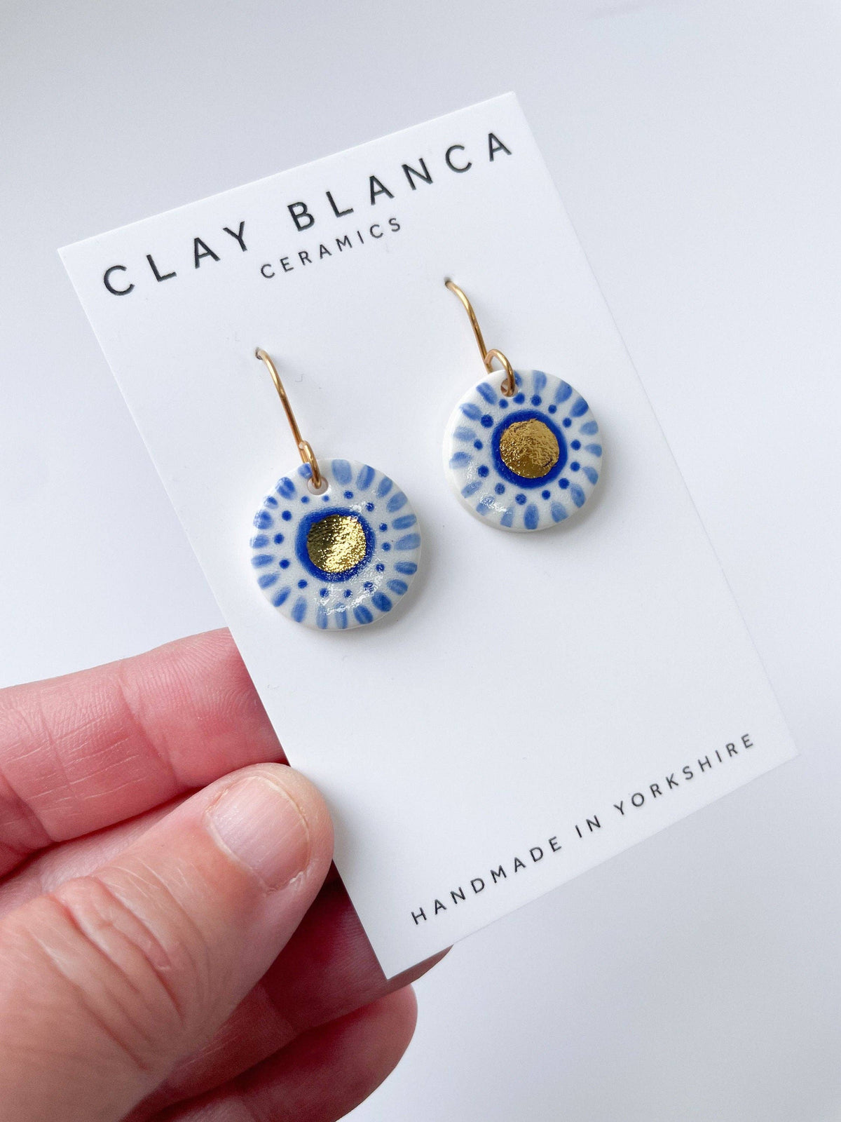 Hand Painted Dark Blue Dot Dangle earrings with gold centre