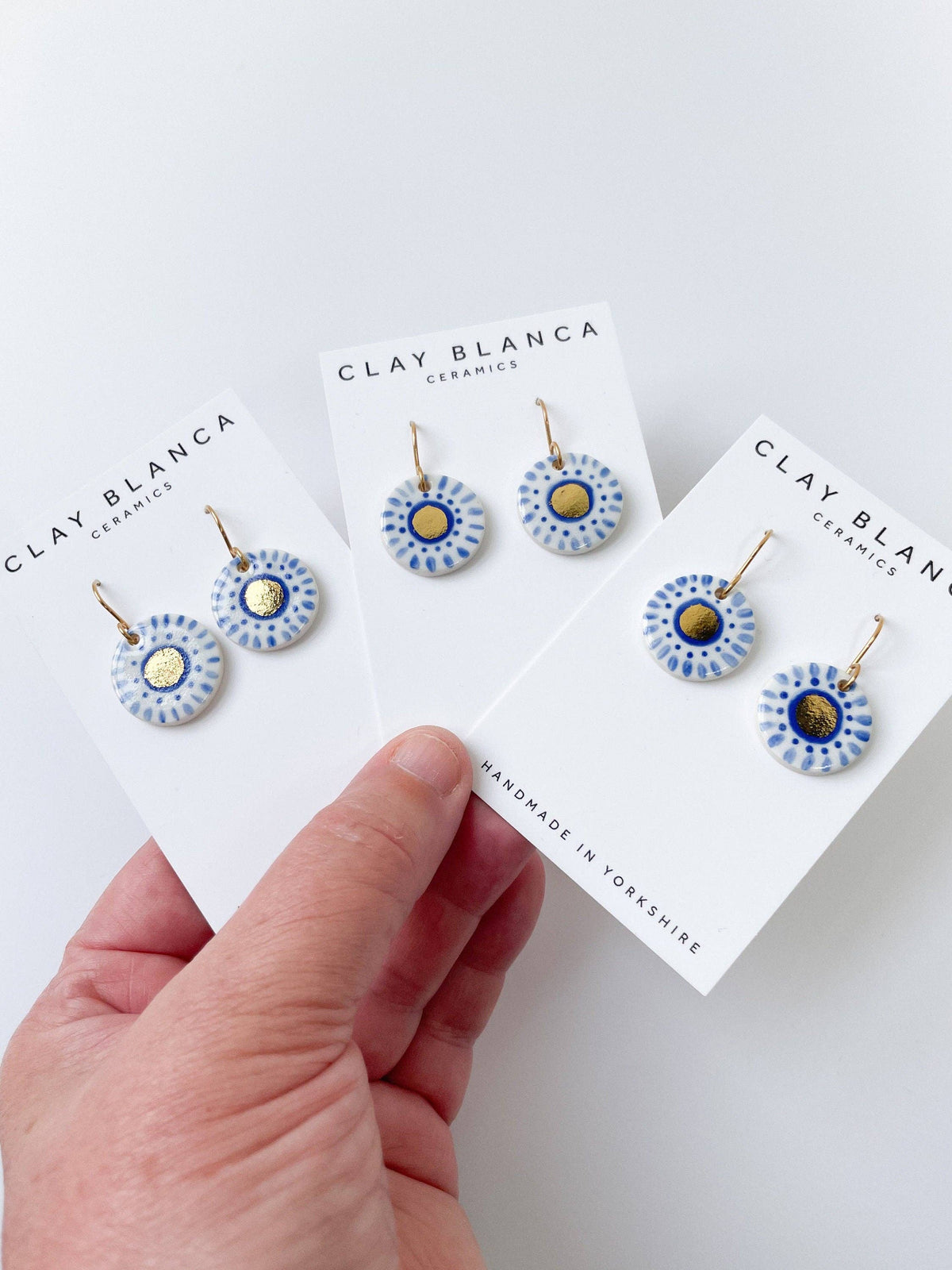 Hand Painted Dark Blue Dot Dangle earrings with gold centre