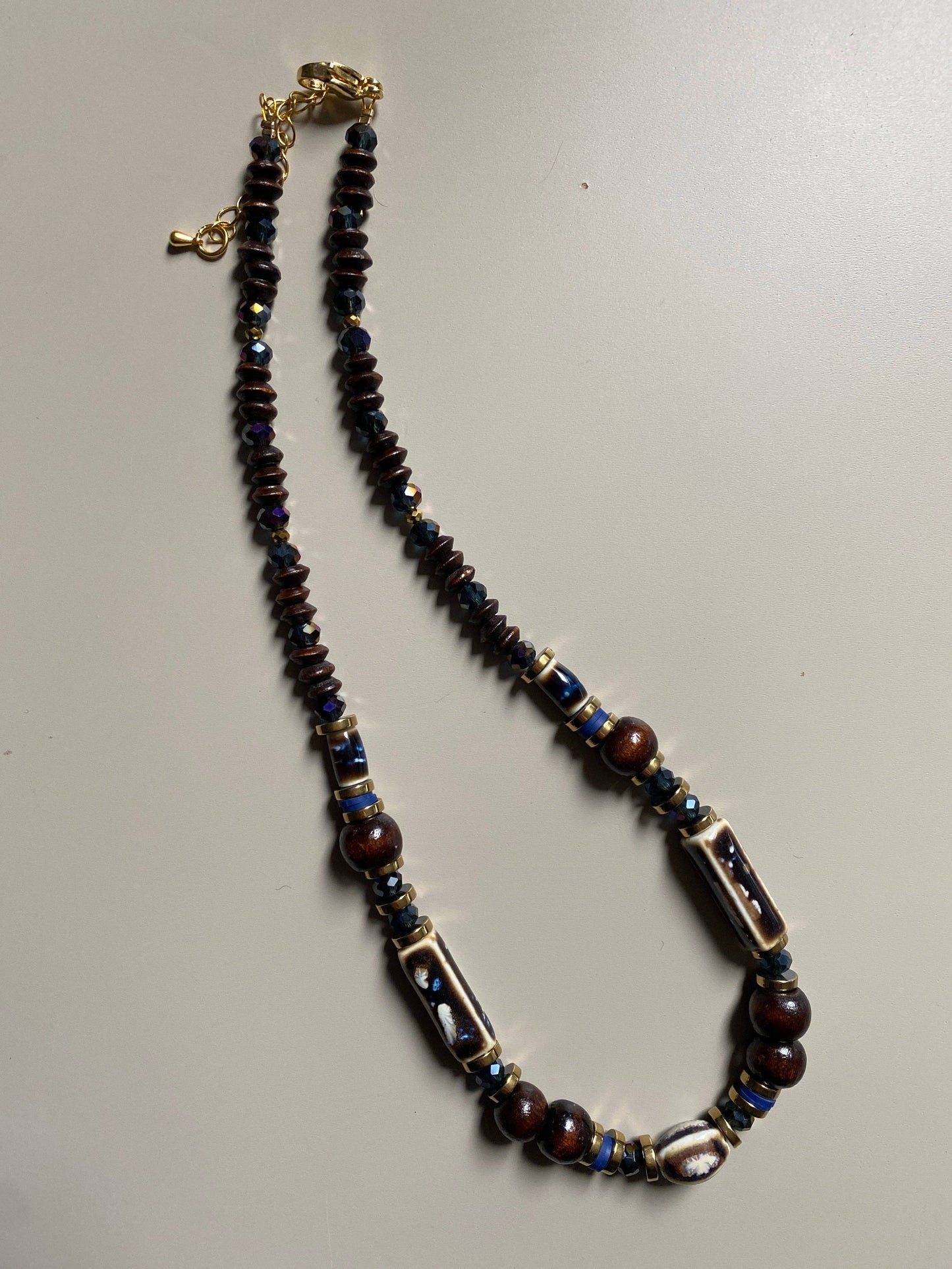 Gist Porcelain, coconut, dyed wood, clay and crystal necklace