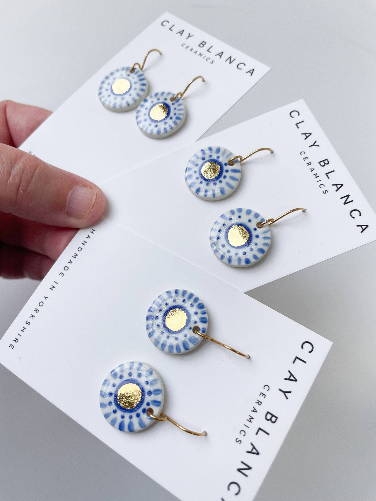 Hand Painted Dark Blue Dot Dangle earrings with gold centre