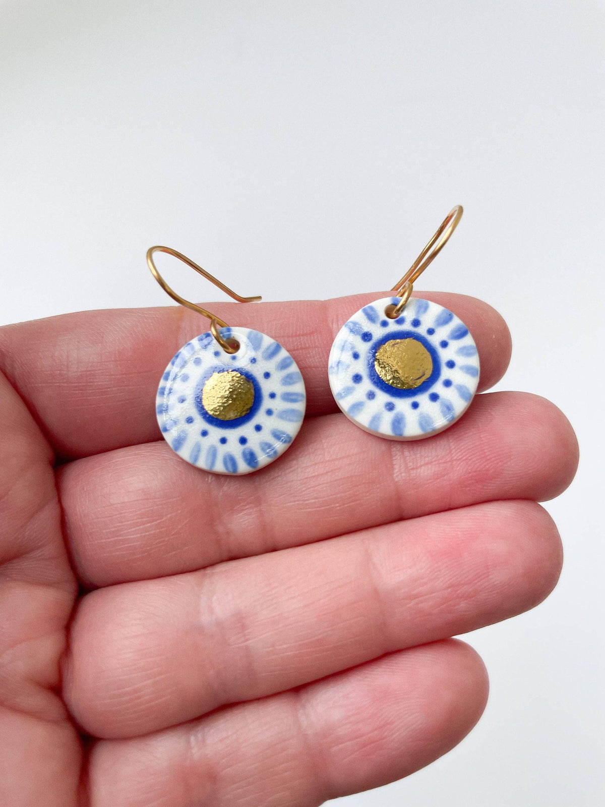 Hand Painted Dark Blue Dot Dangle earrings with gold centre